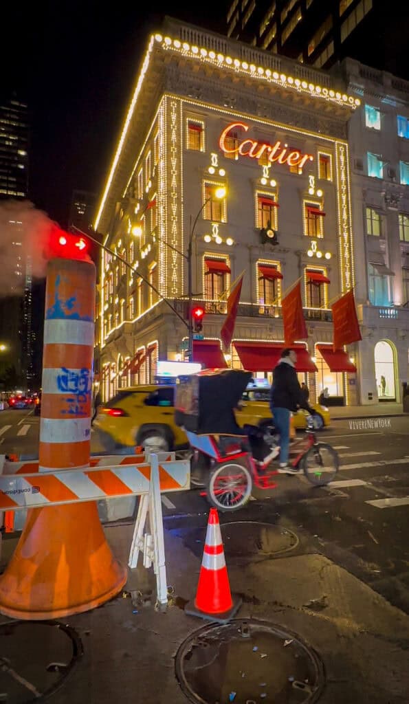 Cartier holiday window display Fifth Avenue NYC Christmas red ribbon luxury store