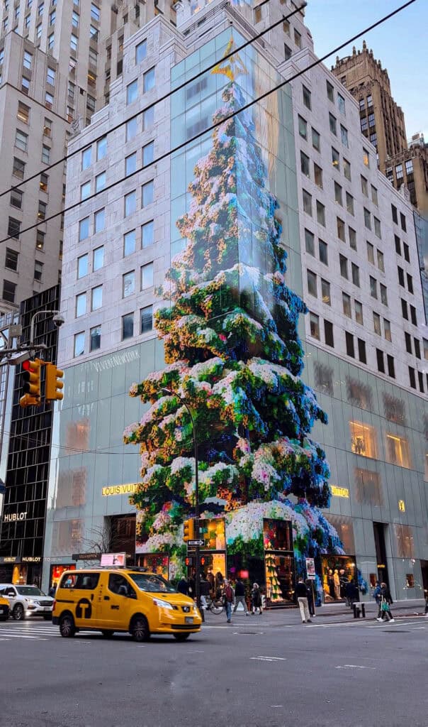 Louis Vuitton holiday window Fifth Avenue NYC Christmas luxury storefront decoration