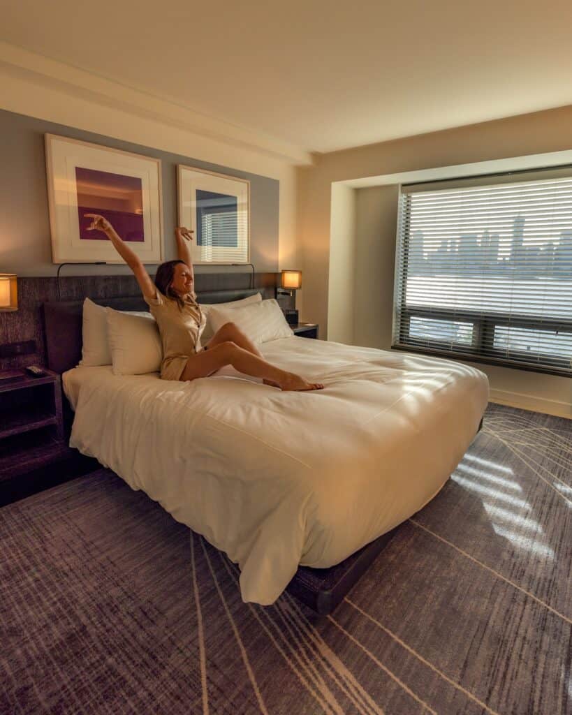 Corner suite Conrad New York Downtown hotel with natural light and Hudson River views
