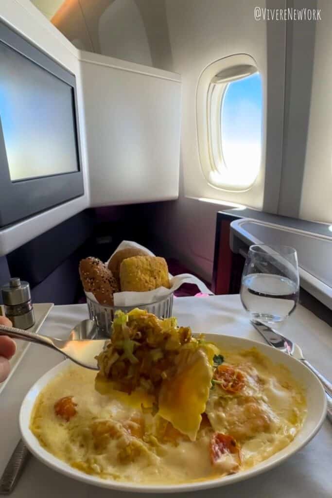 Qatar Airways Qsuite fine dining lobster champagne date in the clouds business class