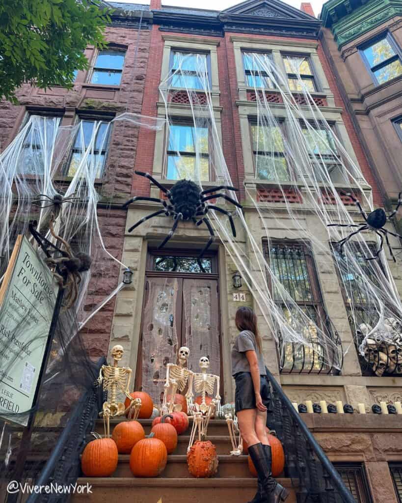NYC Halloween decorated brownstone spiders skeletons pumpkins Upper West Side October