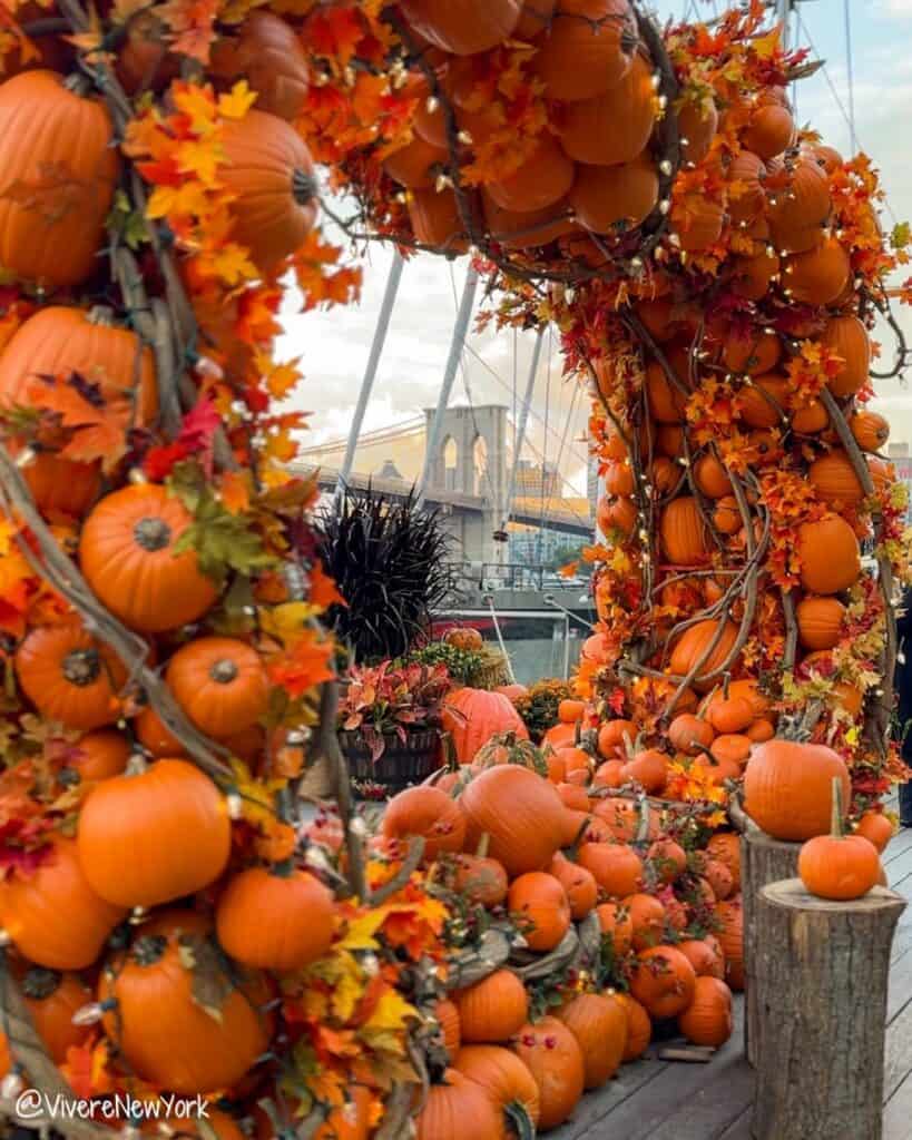 Pier 17 Pumpkin Arch South Street Seaport NYC fall Brooklyn Bridge backdrop October