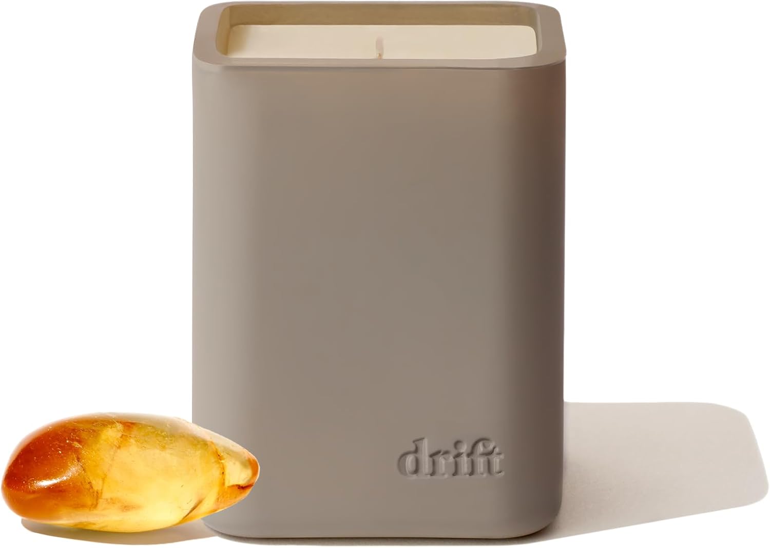 Drift Amber Scented Candle in minimalist beige container