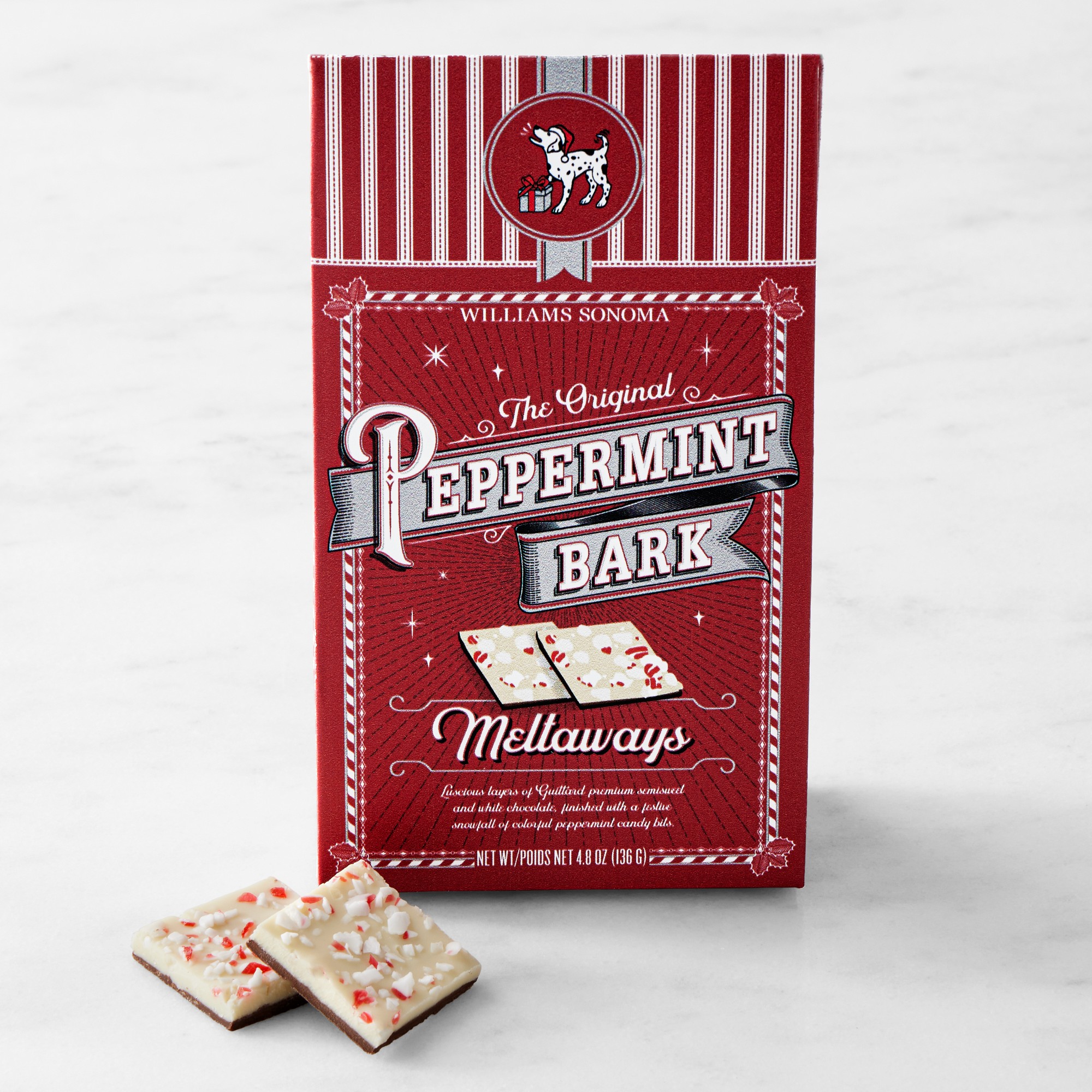 Williams Sonoma Peppermint Bark Meltaways in red holiday box with white chocolate peppermint pieces displayed in front