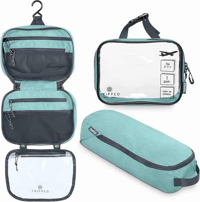 Hanging travel toiletry bag with multiple compartments open and hung in a bathroom