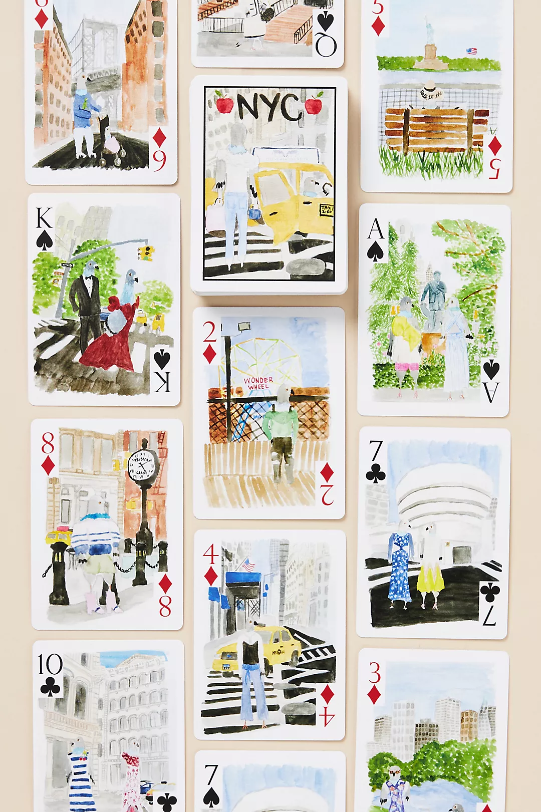 Anthropologie Loulou Baker NYC watercolor playing cards featuring illustrated New York scenes.