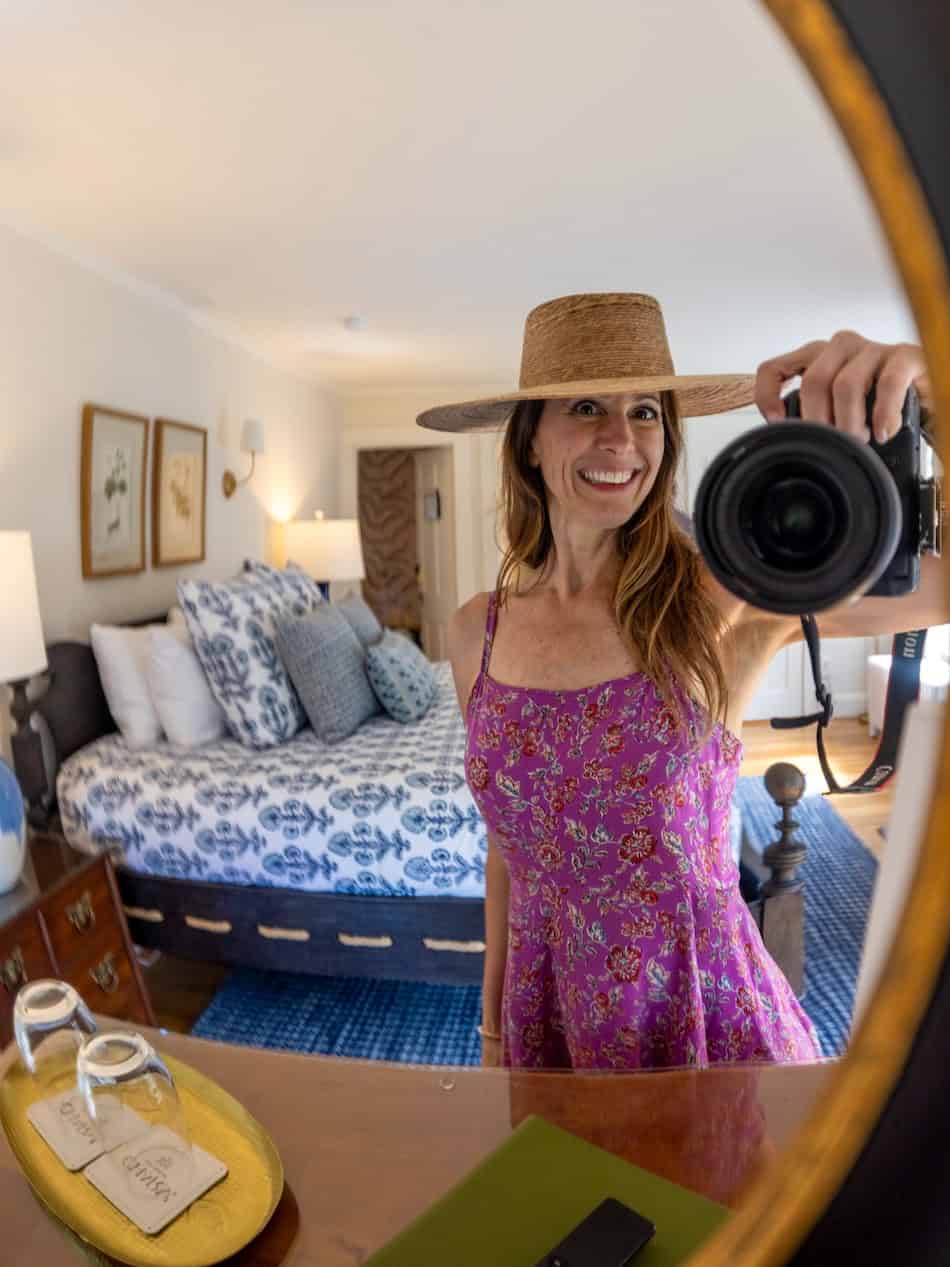Laura from VivereNewYork taking a mirror selfie with her camera in her room at The Charm on Main, an adults-only inn in Brewster, Cape Cod
