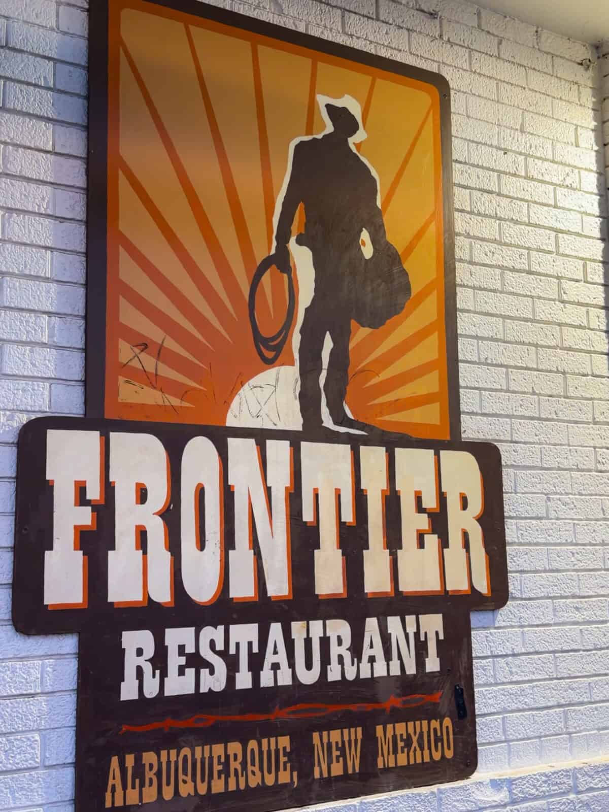 The iconic Frontier Restaurant cowboy sign in Albuquerque, New Mexico, a Route 66 institution since 1971
