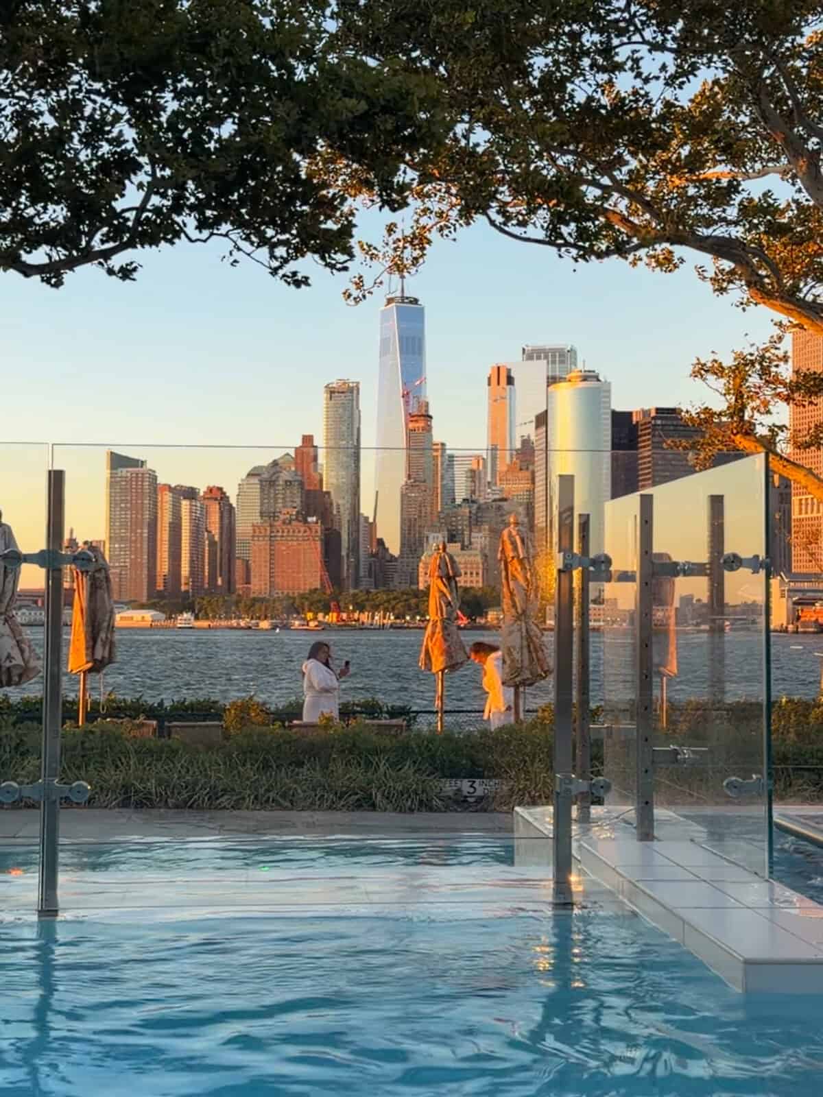 Heated outdoor pool at QC NY Spa overlooking the Manhattan skyline