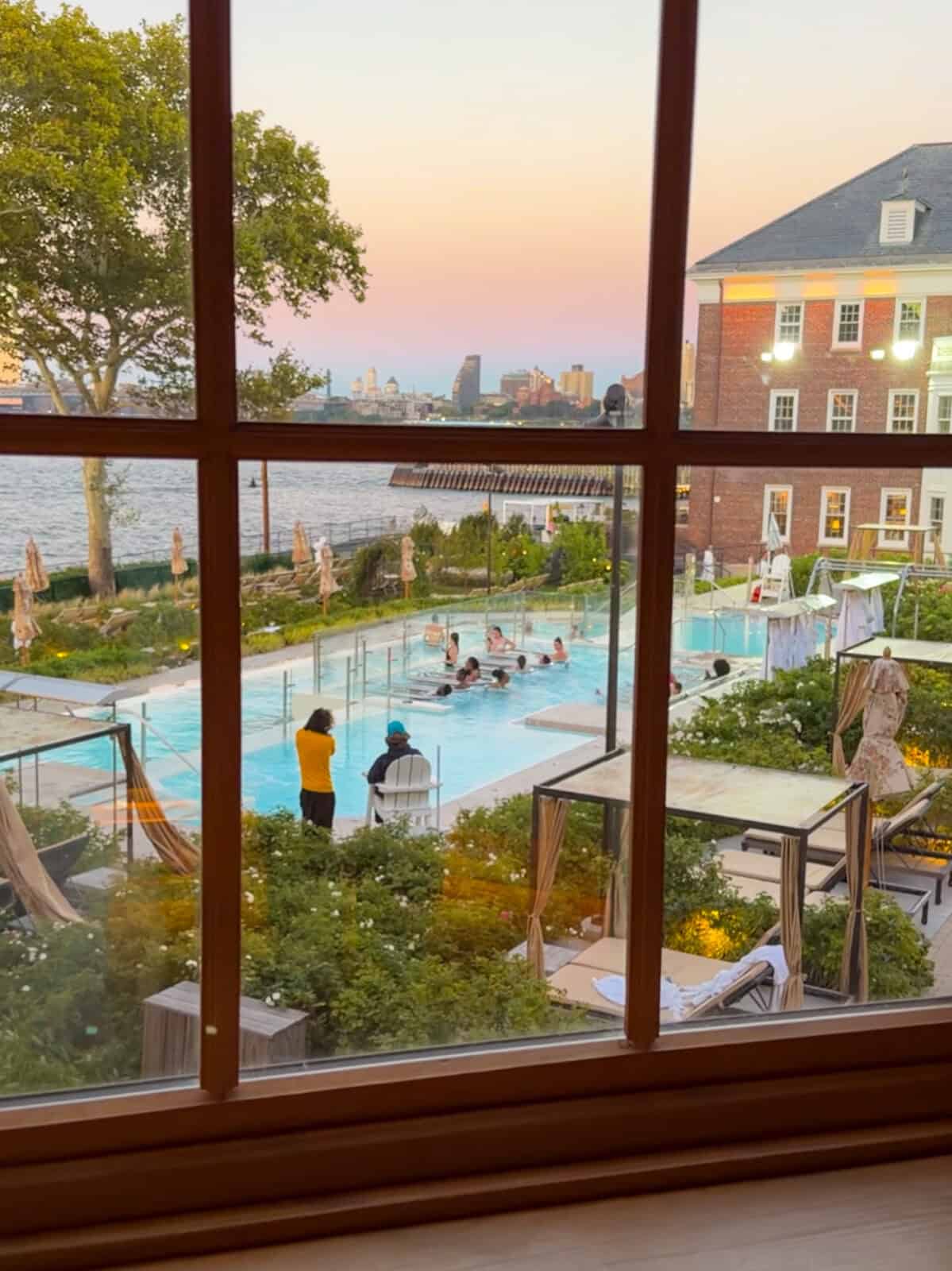View of the heated outdoor pools at QC NY Spa from a relaxation room